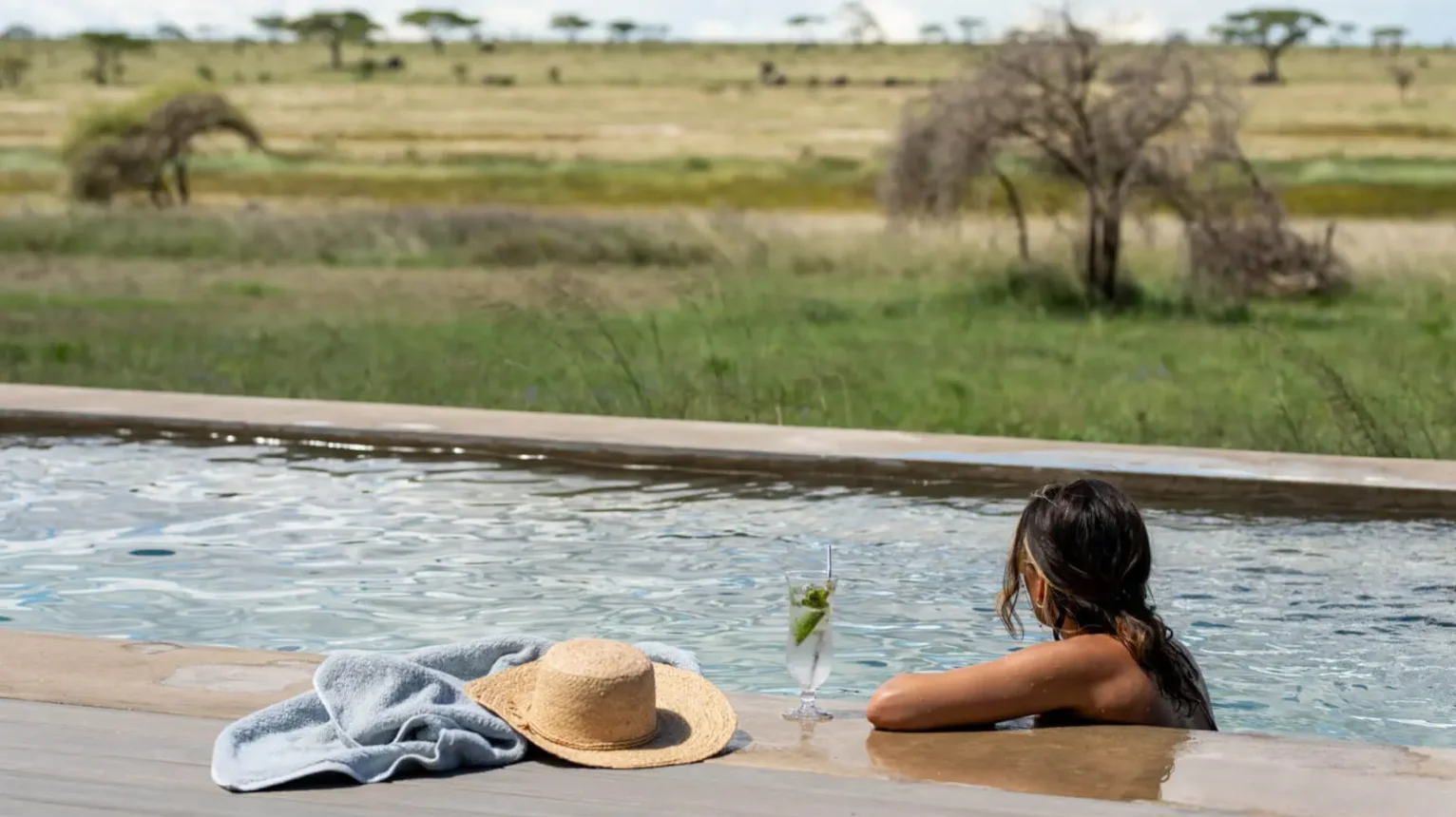 Asilia-Guest-Enjoying-the-Swimming-Pool-at-Namiri-Plains-Retreat