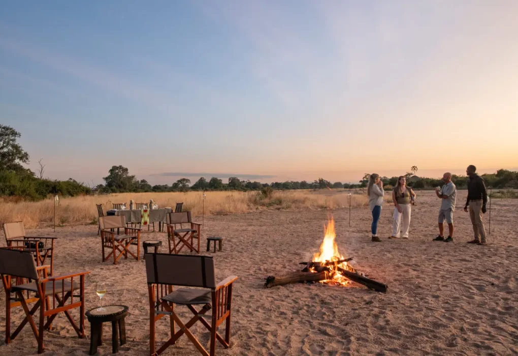 asilia-guests-with-camp-fire-at-sunset-1536x864.jpg